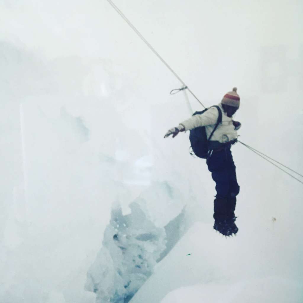 Filiberto Rurush crossing a crevasse in the Andes